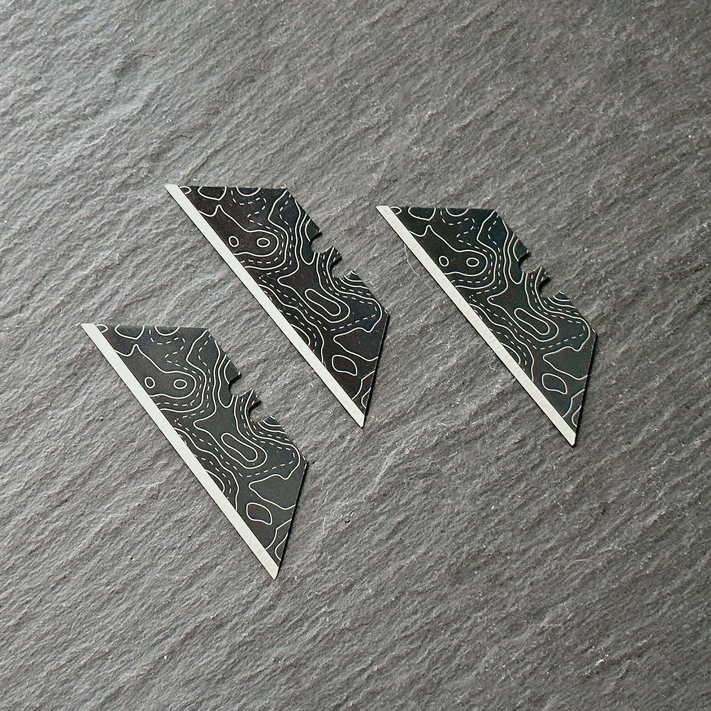 Stinger Laser Engraved Utility Razor Blades, Utility Knife Blades Replacement - Black Topographic Style (Trapezoid 3 pcs - Black)